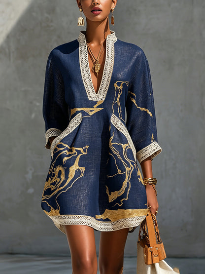 Laurent | Minivestido de ganchillo azul marino con motivos dorados y escote en V