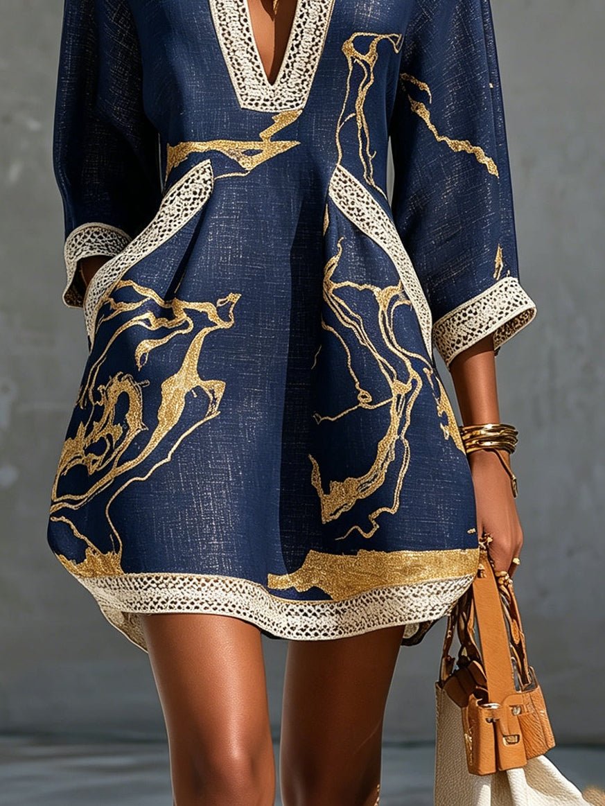 Laurent | Minivestido de ganchillo azul marino con motivos dorados y escote en V