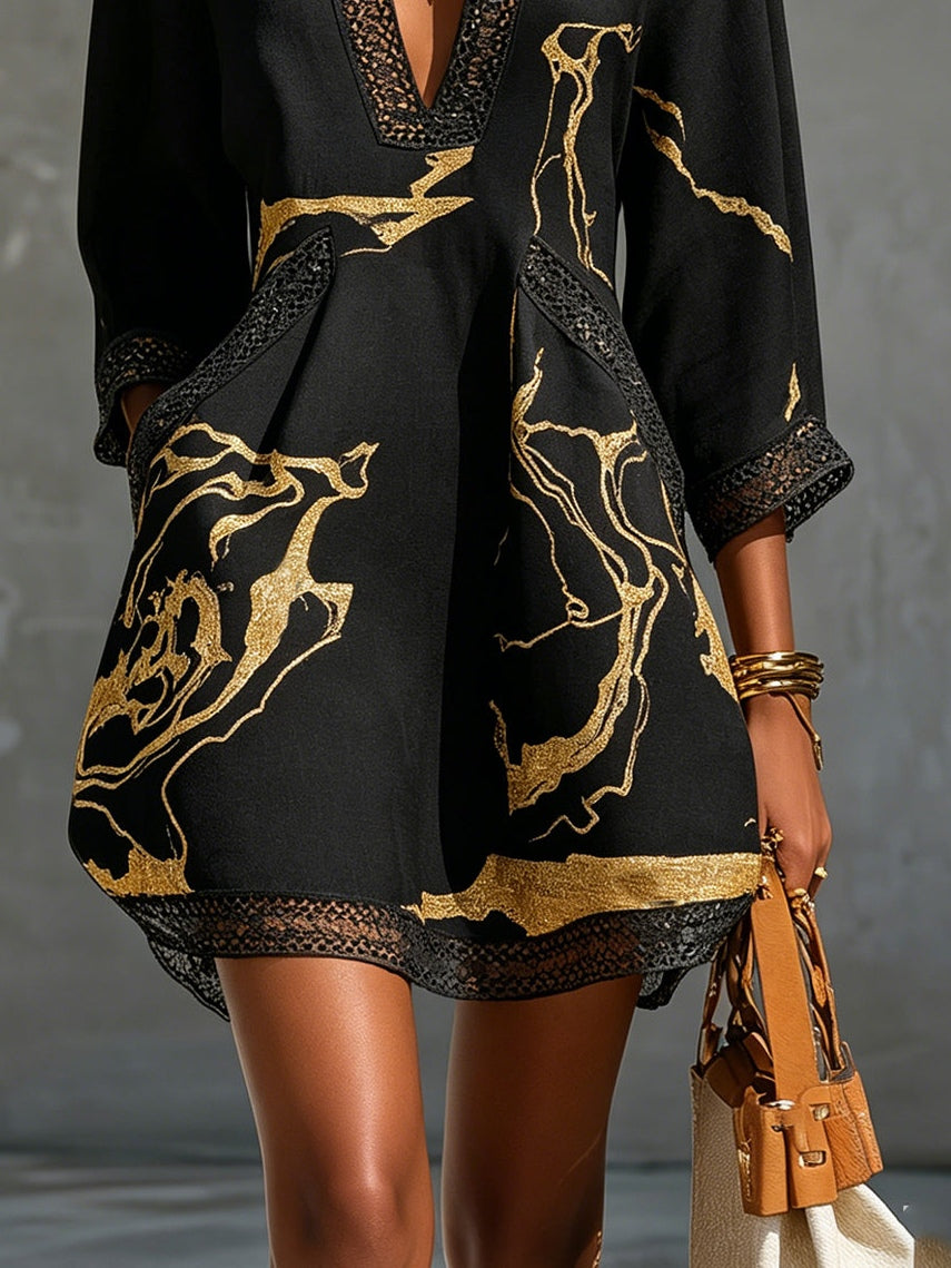 Laurent | Minivestido de ganchillo negro con motivos dorados y escote en V