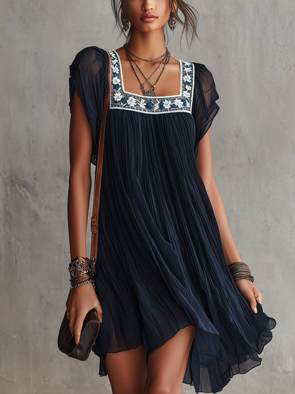 Laurent | Minivestido plisado de gasa con bordado floral azul marino