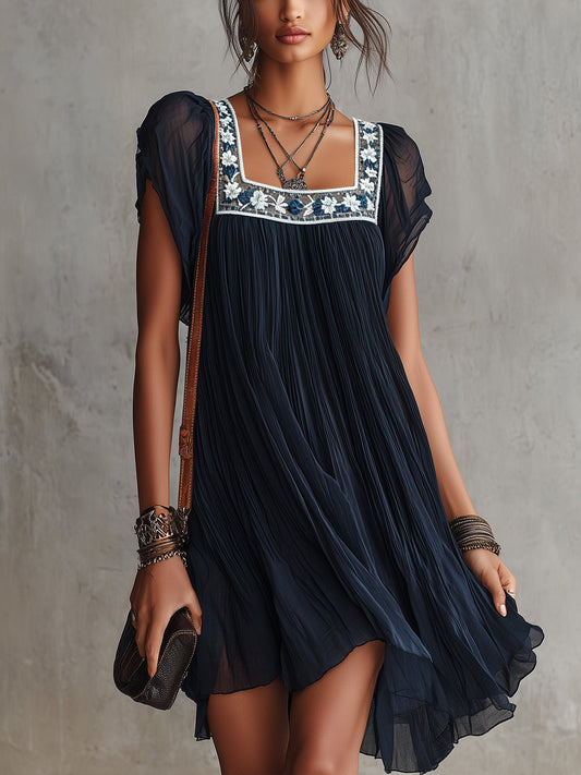 Laurent | Minivestido plisado de gasa con bordado floral azul marino